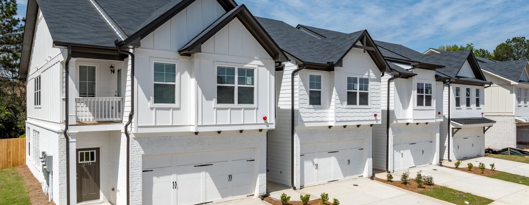 white houses with driveways