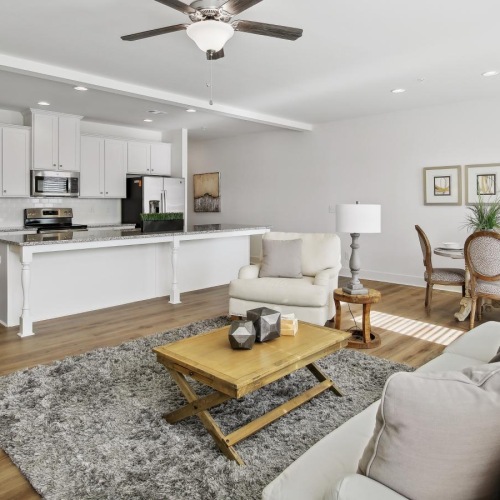 a living room with a large ceiling fan