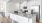 a kitchen with white cabinets